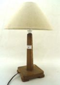 An early 20th century oak table lamp,