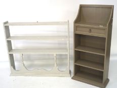 Two open frame painted bookcases, one with a drawer to the top,