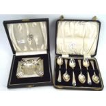 A silver ashtray and set of six silver teaspoons,