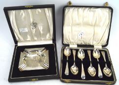 A silver ashtray and set of six silver teaspoons,