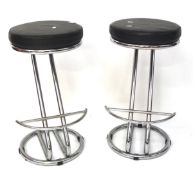 A pair of contemporary chrome bar stools,
