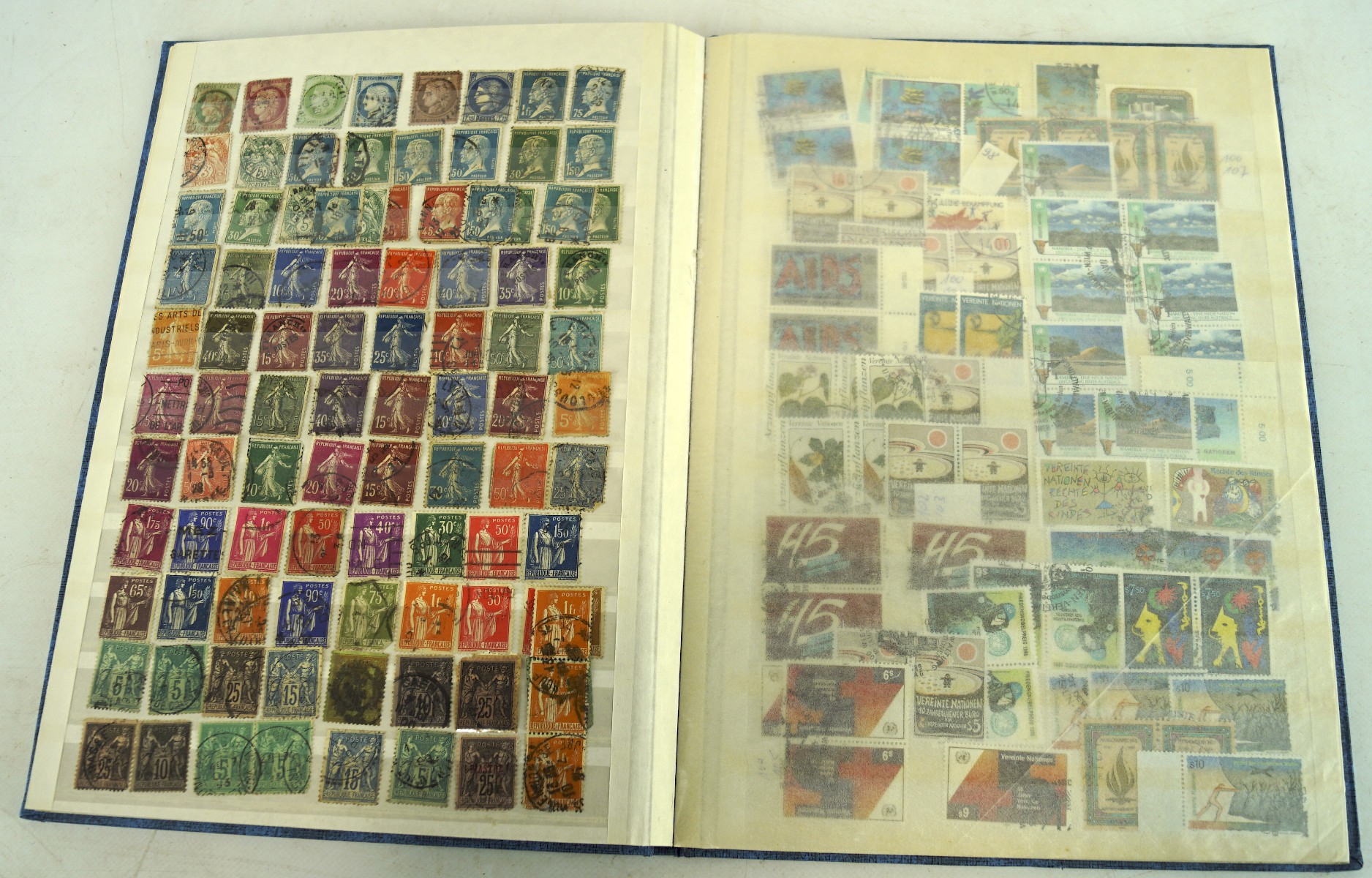 A vintage stock book containing a selection of French stamps,