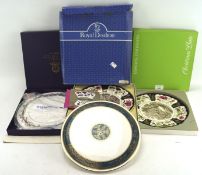 Four boxed porcelain decorative plates including two gateaux platters,
