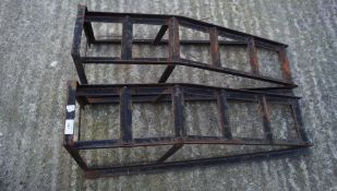 Two cast metal ramps,