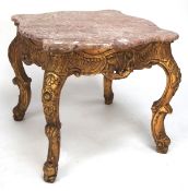 A 20th century gilt wood marble topped coffee table, raised upon four cabriolet supports,
