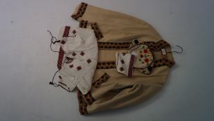 Four items of 1930's traditional Croatian folk costume, including a woollen jacket and matching hat,