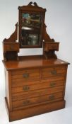 An Edwardian mahogany chest of drawers with dressing table mirror,