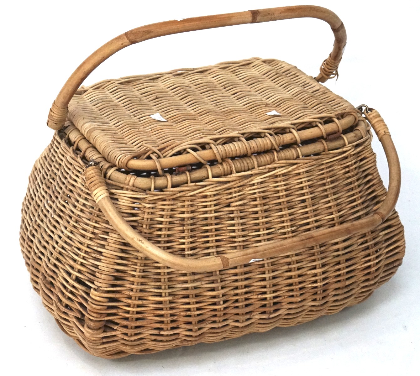 A large fishing style wicker basket with two bamboo handles,