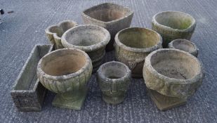Ten reconstituted stone planters, some modelled as urns and barrels,