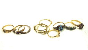 A collection of eight gold and yellow metal dress rings,