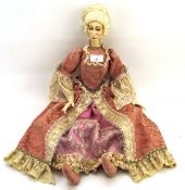 A 20th century doll in the form of a lady in pink dress,