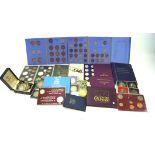 A collection of coins, mostly GB base metal decimal presentation coin sets, plus pre-decimal coins,