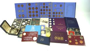 A collection of coins, mostly GB base metal decimal presentation coin sets, plus pre-decimal coins,
