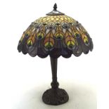 A contemporary Tiffany style table lamp, with coloured glass shade,