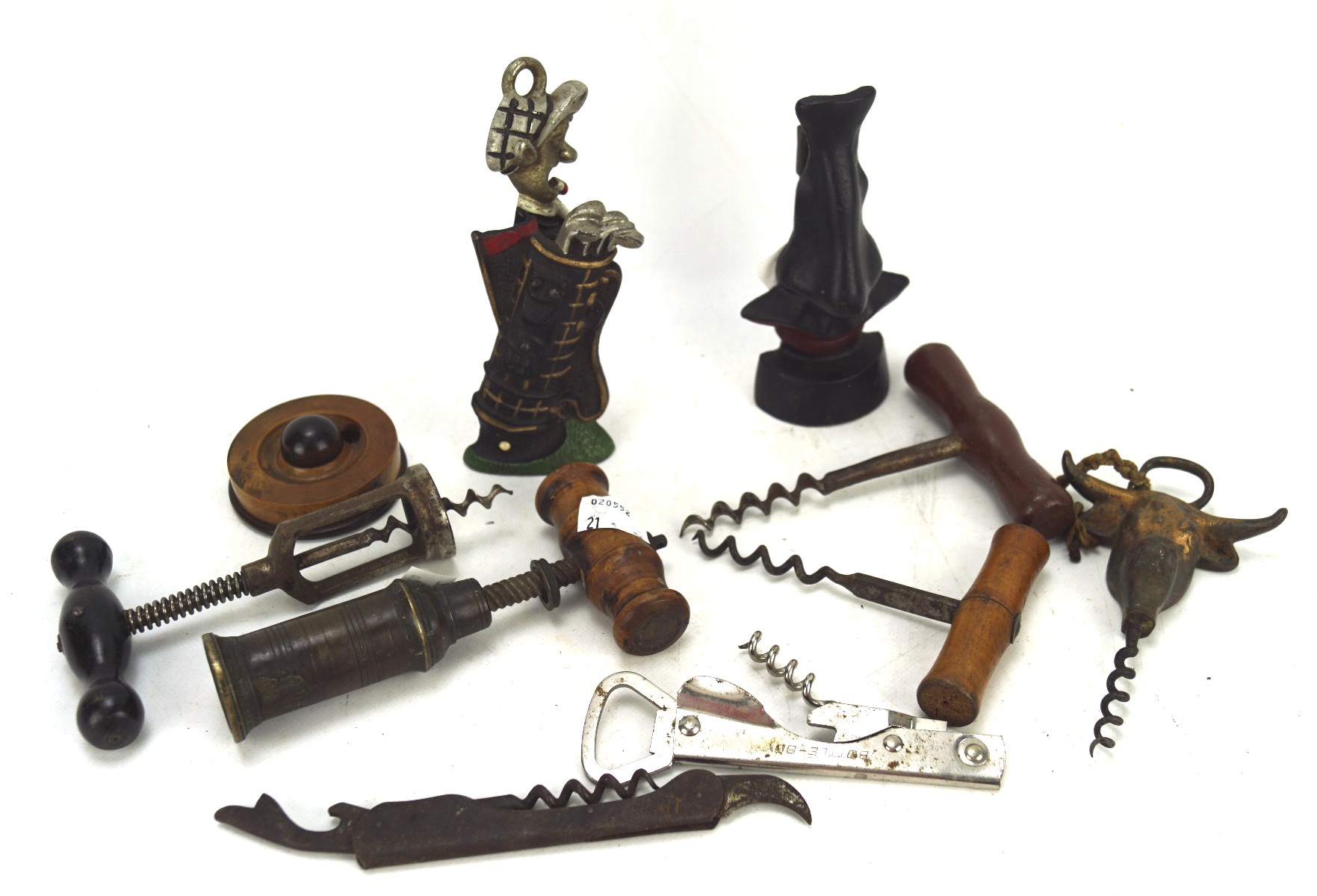 A collection of vintage corkscrews and bottle openers,