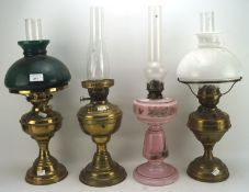 Four 20th century oil lamps,