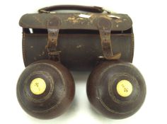 A pair of early 20th century wooden bowling woods,