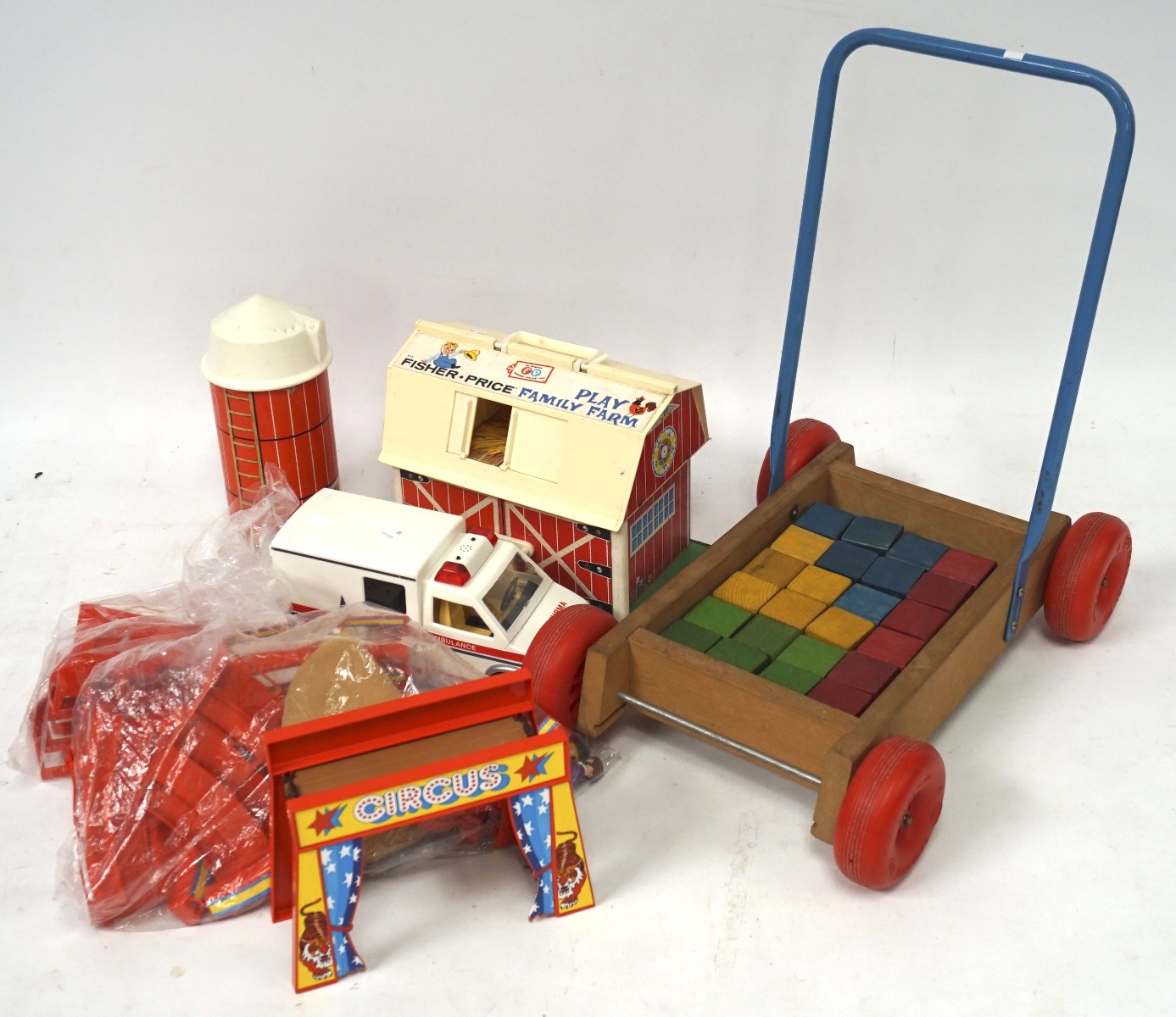 A vintage Fisher Price toy farm and selection of other toys,