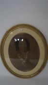 A large portrait sketch of a woman, of oval form, framed and glazed in gilt frame,