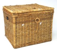 A large wicker hamper and a round basket,