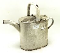 A vintage white enamel watering can,