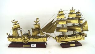 Two metal models of ships, mounted on wooden bases with plaques, one of 'USS Constitution',