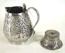 A 20th century Burmese white metal pouring jug and similar lidded pot,