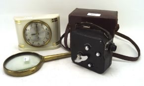 An assortment of collectables, including a typewriter, Tazz alarm clock, pathescope, and more