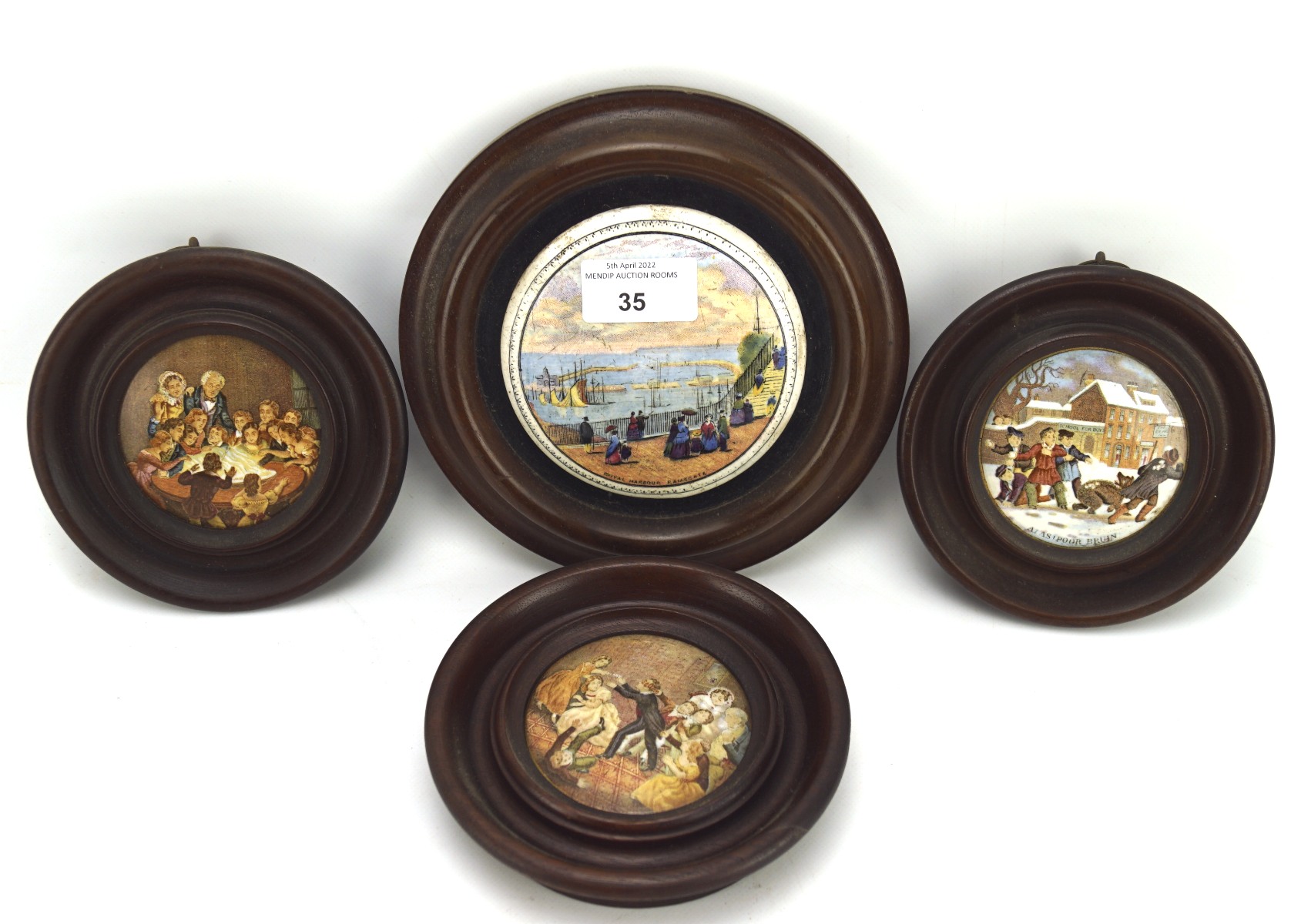 Four 20th century pot lids with printed decoration,