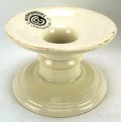 A ceramic 'Harris Stand' by G Rushbrooke Smithfield Ltd, on a circular base with white glaze,