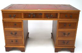 A reproduction pine and yew wood desk,