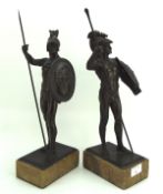 A pair of cast metal figures in the form of gladiators,