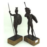 A pair of cast metal figures in the form of gladiators,