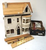 A contemporary part built doll's house,