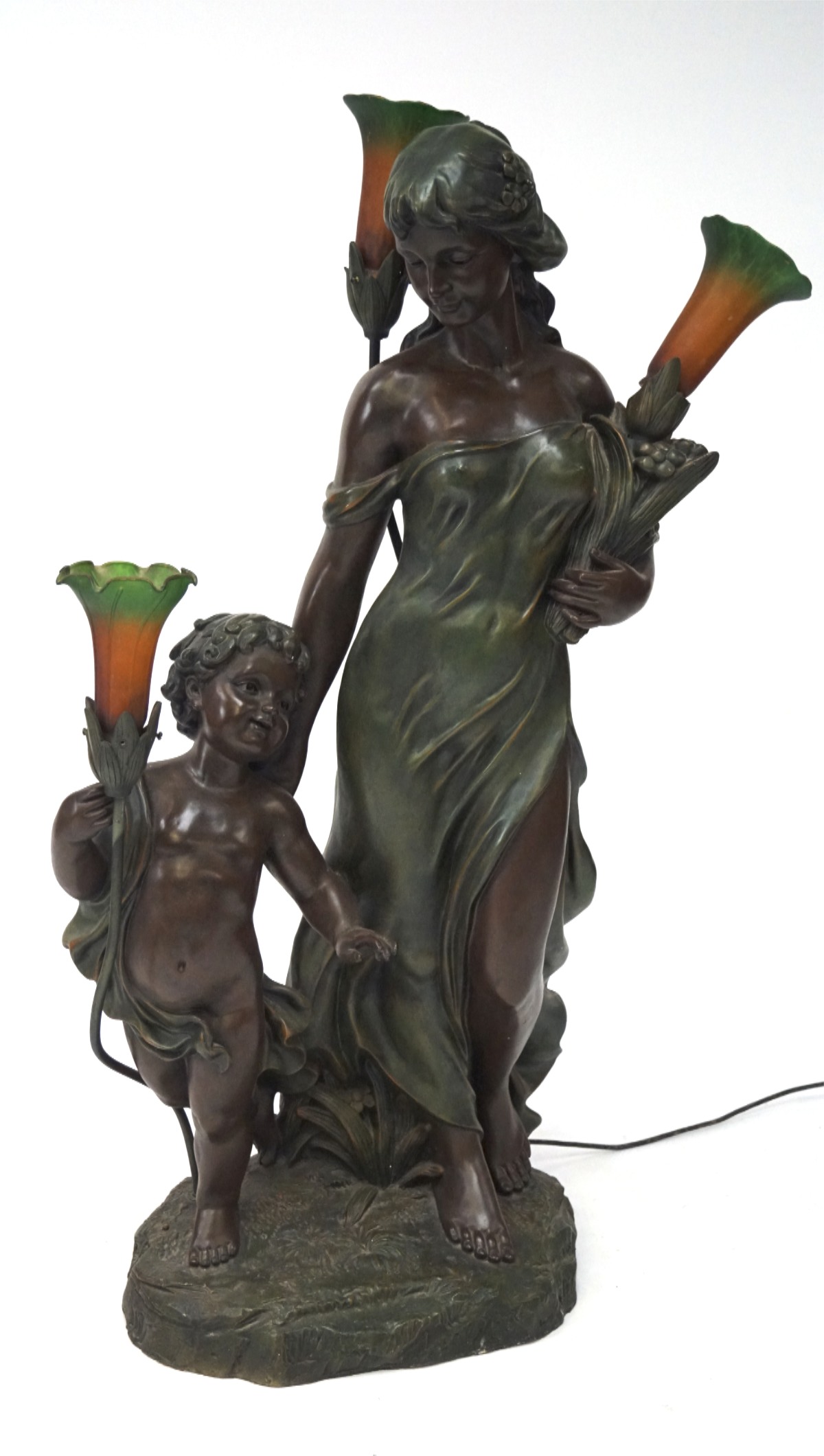 A large bronzed figural lamp, modelled as a Gretian figure and a cherub,