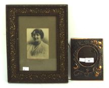 Two photo frames, comprising one copper example and a wood example