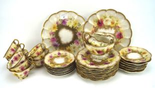 A Crescent part tea and dinner service, all decorated with flowers on a gilt and yellow ground,