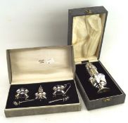 A silver sugar sifter in box and condiments,