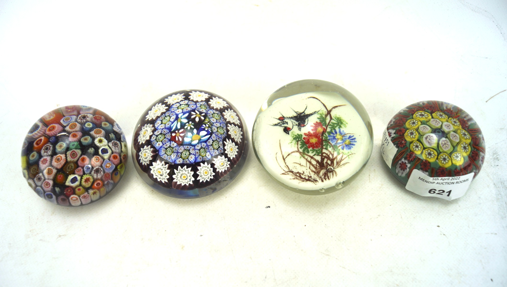Four 20th century glass paperweights,
