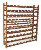 A large pine wine rack with eight racks,