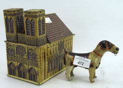A DRGM German tin plate musical Cathedral and clockwork dog, both with lithoprint decoration,