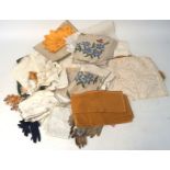 An assortment of 20th century textiles and lace together with assorted ladies gloves