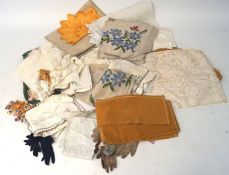 An assortment of 20th century textiles and lace together with assorted ladies gloves