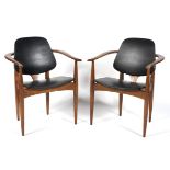 A pair of contemporary carver chairs, the wooden frames with tapered supports,