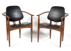 A pair of contemporary carver chairs, the wooden frames with tapered supports,