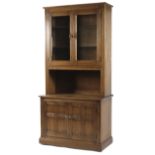 An Ercol glazed display cabinet,