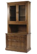 An Ercol glazed display cabinet,