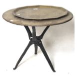 A Middle Eastern brass topped table, mounted on a wooden base, L62cm x H53cm,