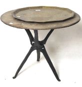 A Middle Eastern brass topped table, mounted on a wooden base, L62cm x H53cm,