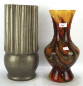 A large studio glass baluster shaped vase decorated in Autumn colours H36cm and a plaster vase of